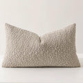 Brown chenille bouclé throw pillow with textured beige and ivory fabric