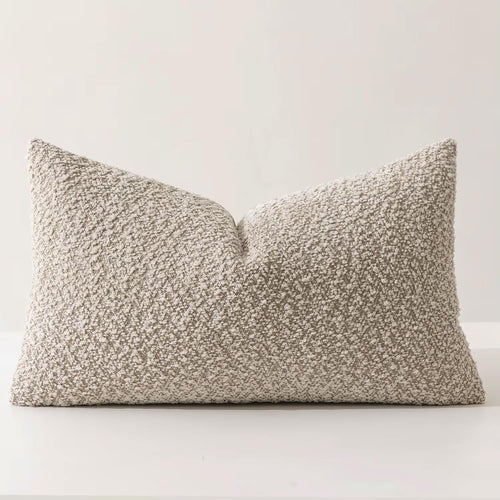 Brown chenille bouclé throw pillow with textured beige and ivory fabric