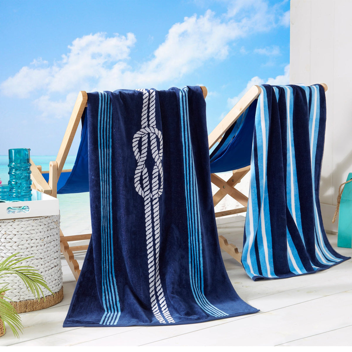Maui Cotton Velour Beach Towel in vibrant green designs displayed on a chair by the beach.