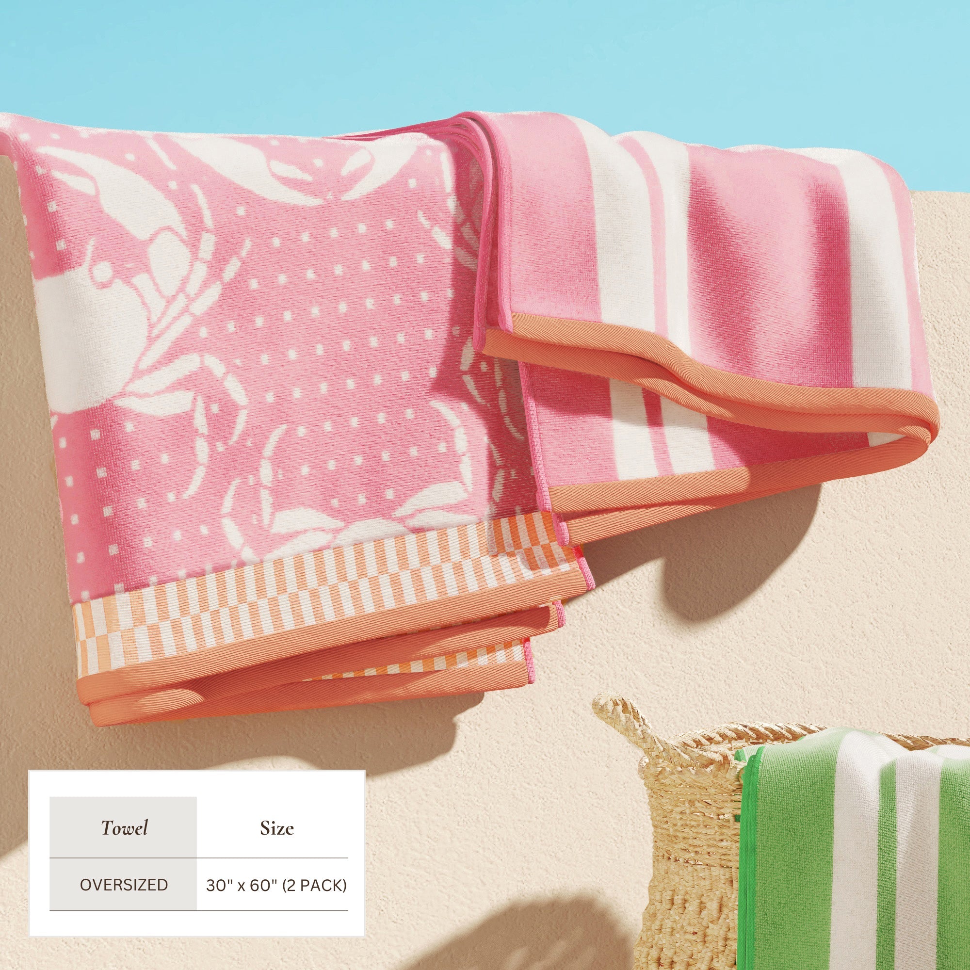 Maui Cotton Velour Beach Towel in vibrant green designs displayed on a chair by the beach.