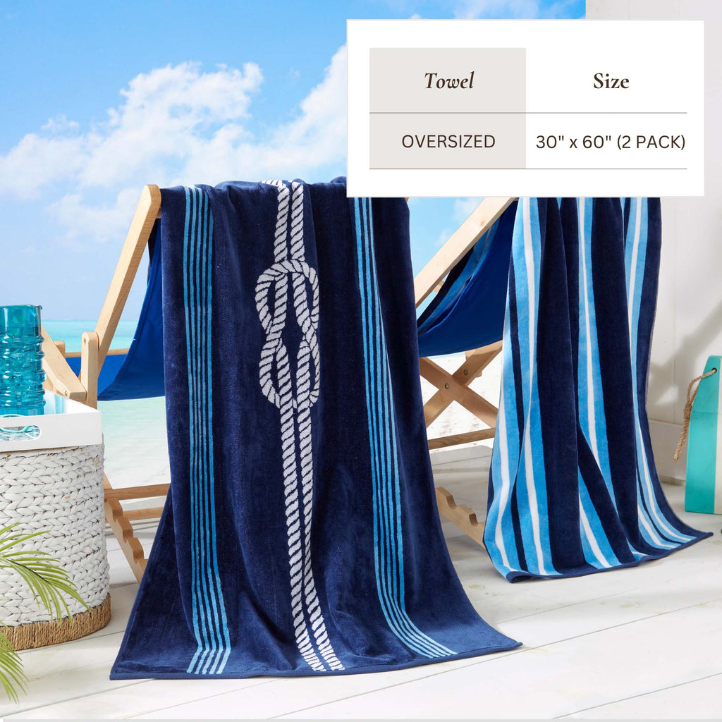 Maui Cotton Velour Beach Towel in vibrant green designs displayed on a chair by the beach.