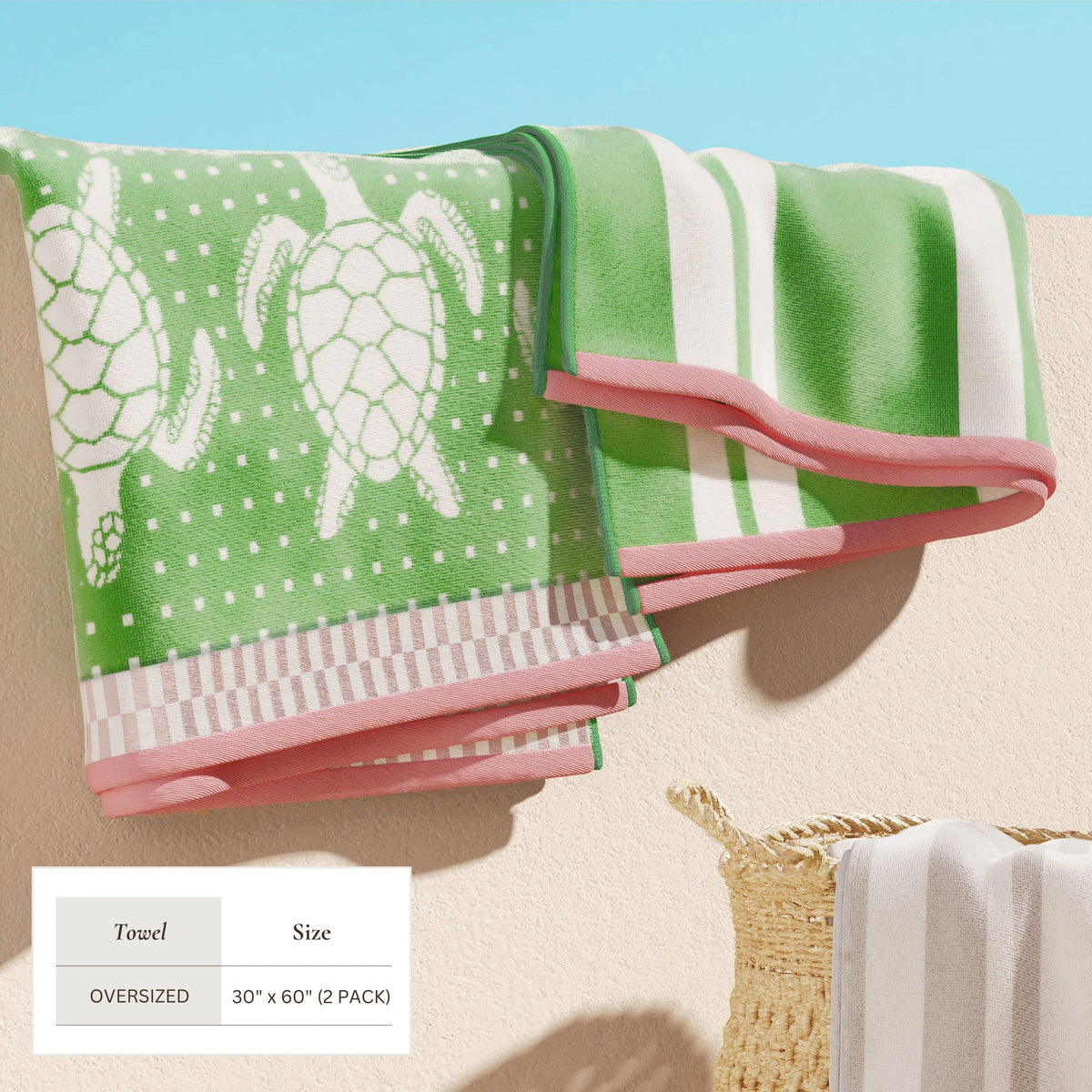 Maui Cotton Velour Beach Towel in vibrant green designs displayed on a chair by the beach.