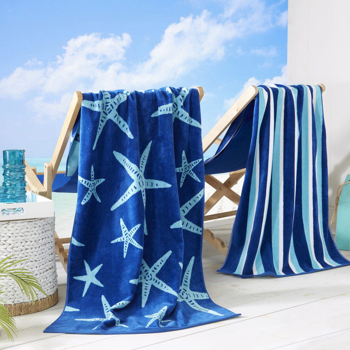 Maui Cotton Velour Beach Towel in vibrant green designs displayed on a chair by the beach.