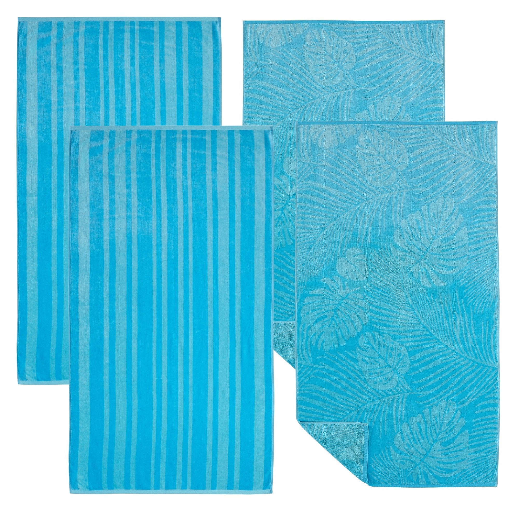 Maui Cotton Velour Beach Towel in vibrant green designs displayed on a chair by the beach.
