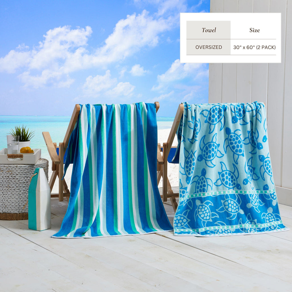 Maui Cotton Velour Beach Towel in vibrant green designs displayed on a chair by the beach.
