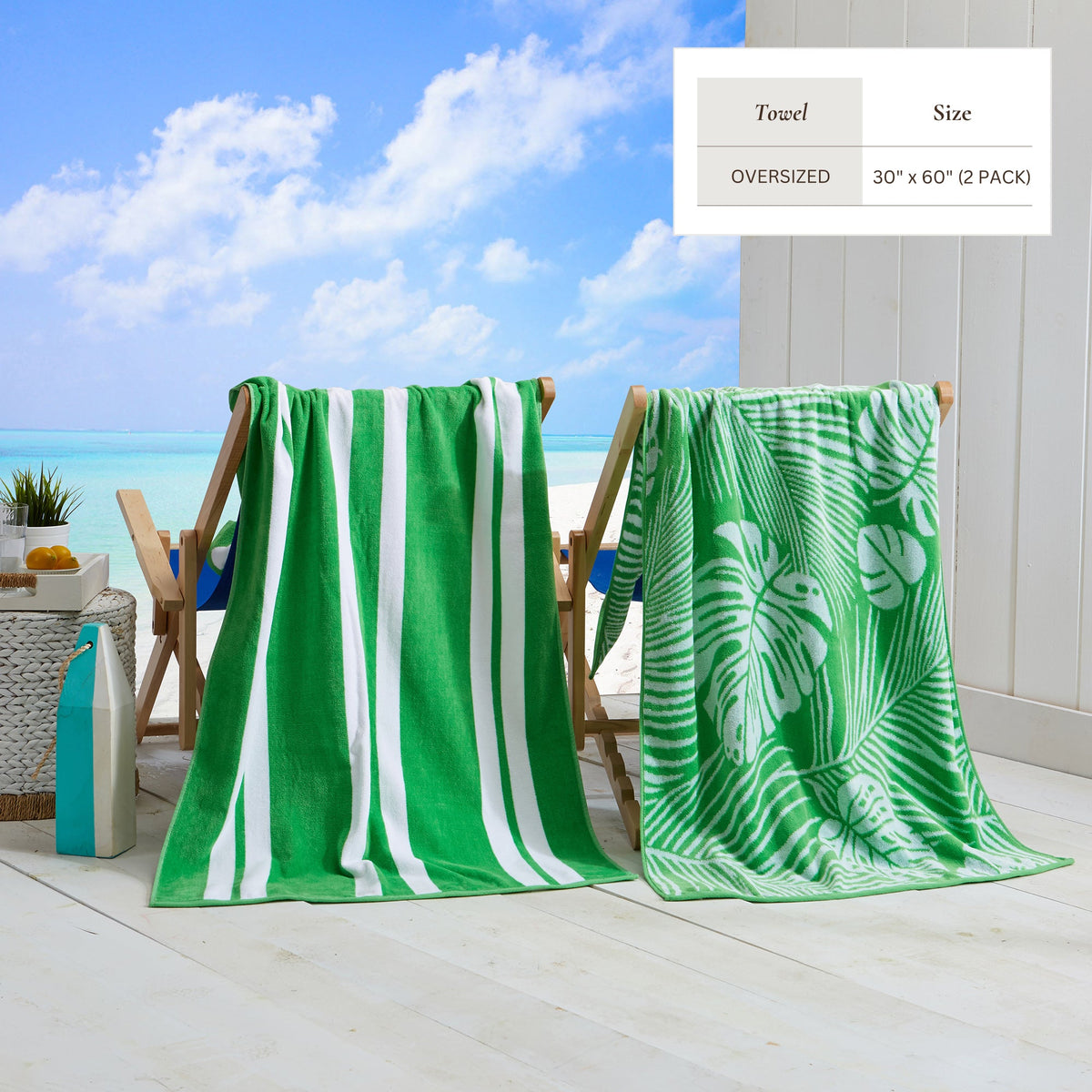 Maui Cotton Velour Beach Towel in vibrant green designs displayed on a chair by the beach.